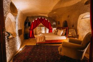 A bed or beds in a room at Prime Cappadocia Suites