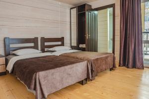 Postel nebo postele na pokoji v ubytování Кільце Карпат + 9 fotografií