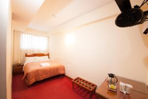 Postel nebo postele na pokoji v ubytování Hostal El Peregrino