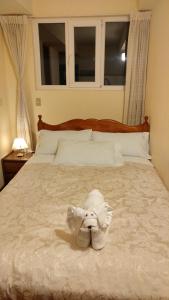 Postel nebo postele na pokoji v ubytování Hostal El Peregrino