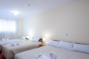 Postel nebo postele na pokoji v ubytování Hostal El Peregrino