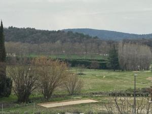 a skate park with a skateboard ramp in a field at Les Palivettes 2.1 in Malaucène +2 photos