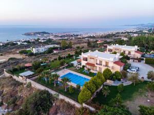 an aerial view of a house with a swimming pool at VILLA PASIFAI in Tria Monastiria