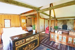 a bedroom with a bed and a fireplace at The Chapel at Crackenback in Crackenback