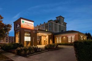 a building with a sign in front of it at Royal Hotel Regina, Trademark Collection by Wyndham in Regina
