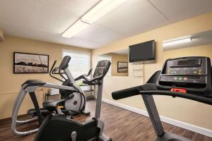 a gym with two exercise bikes in a room at Royal Hotel Regina, Trademark Collection by Wyndham in Regina