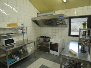 a kitchen with a stove top oven in a kitchen at Spacious Holiday Home in Vielsalm with Garden in Vielsalm