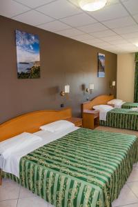 Un pat sau paturi într-o cameră la Hotel San Giorgio