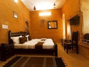 Postel nebo postele na pokoji v ubytování Hotel Royal Haveli