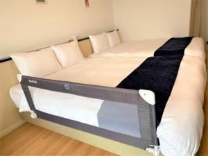 Postel nebo postele na pokoji v ubytování Hotel Sakurano Familia Nago