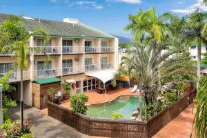 an aerial view of a hotel with a pool and palm trees at Cairns City Sheridan Motel in Cairns