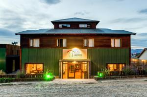 a large green building with a sign that reads cisco at Hostería Los Gnomos in El Calafate