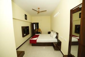 Voodi või voodid majutusasutuse Akash Residency toas