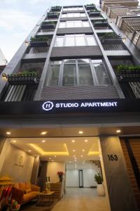 a building with a sign for a studio apartment at Alaya Cau Giay -Yen Hoa Homestay and Apartment in Hanoi
