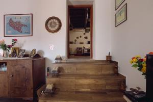 a room with stairs and a clock on the wall at Villa Roxani in Mesklá +40 photos