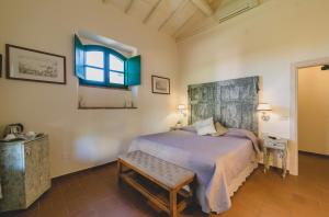 Кровать или кровати в номере Country Relais La Mortella