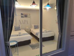 Postel nebo postele na pokoji v ubytování Napa Hostel Samrong Station