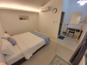 Postel nebo postele na pokoji v ubytování Napa Hostel Samrong Station