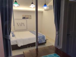 Postel nebo postele na pokoji v ubytování Napa Hostel Samrong Station