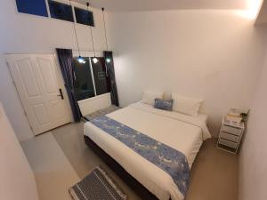 Postel nebo postele na pokoji v ubytování Napa Hostel Samrong Station