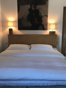 Ένα ή περισσότερα κρεβάτια σε δωμάτιο στο Telemark Guesthouse