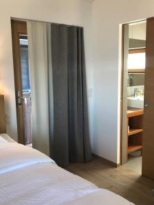 Ένα ή περισσότερα κρεβάτια σε δωμάτιο στο Telemark Guesthouse