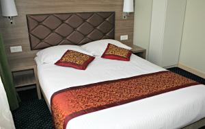 Postel nebo postele na pokoji v ubytování Hotel Washington
