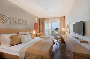 A bed or beds in a room at TUI Blue Barut Andız - All Inclusive - Adults Only