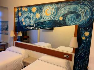 Postel nebo postele na pokoji v ubytování Hotel Brial