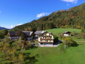 an aerial view of a large house in the mountains at Hinterramsebn in Vorderstoder