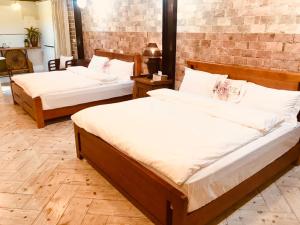 Postel nebo postele na pokoji v ubytování Grace House Homestay 2 + 11 fotografií