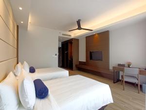 Letto o letti in una camera di Pacific Regency Beach Resort, Port Dickson