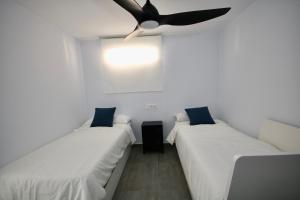 Postel nebo postele na pokoji v ubytování DreamStay - San Cristobal Playa, Almuñecar