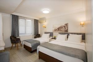 Postel nebo postele na pokoji v ubytování Sim Hotel Istanbul Old City