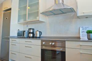 Kuchyň nebo kuchyňský kout v ubytování Apartamento Portobello