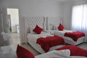 Ένα ή περισσότερα κρεβάτια σε δωμάτιο στο Timo's guesthouse accommodation