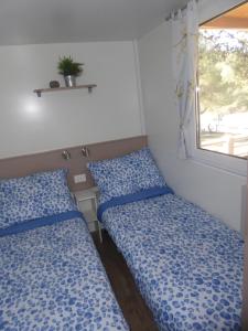 Postel nebo postele na pokoji v ubytování Adriatic Blue Coast Mobile Home