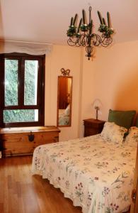 a bedroom with a bed and a window at Paseo del Muelle 2, 3º D Reg VUT 706AS8 in Luarca
