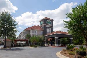 a building with a clock tower on top of it at La Quinta by Wyndham Mobile - Daphne in Daphne