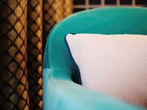 
a pillow that is on top of a chair at Grand Hotel Bregenz - MGallery Hotel Collection in Bregenz
