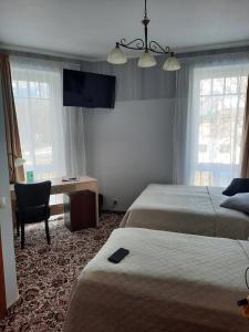 Postel nebo postele na pokoji v ubytování Hotel Pils with Self-Check in