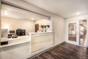 a kitchen with a counter and a window at WoodSpring Suites Bradenton in Bradenton