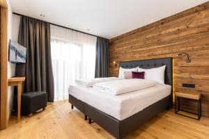 Ліжко або ліжка в номері Bichlhof Going