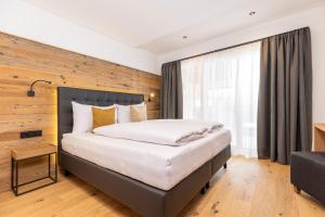 Ліжко або ліжка в номері Bichlhof Going