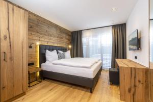 Ліжко або ліжка в номері Bichlhof Going