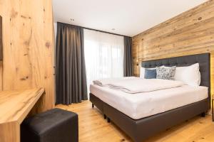 Ліжко або ліжка в номері Bichlhof Going