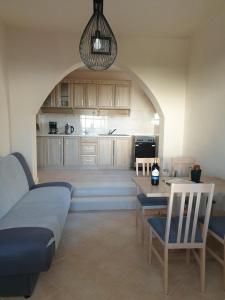 a living room with a couch and a table at Villa Sandrina in Okrug Donji