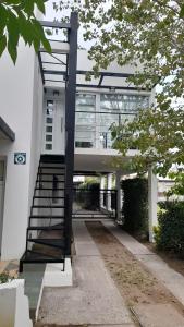a building with a staircase in front of a building at dolce casa 2 in San Clemente del Tuyú