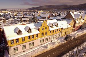 an aerial view of a city covered in snow at Harz Hostel in Wernigerode