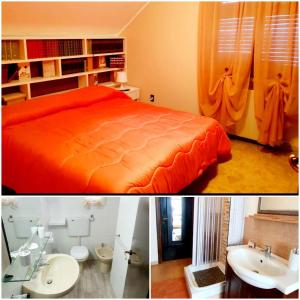 1 dormitorio con cama de color naranja y lavamanos en La casa di Loryanne, en Avezzano
